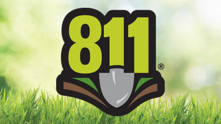 811 Logo over tall grass