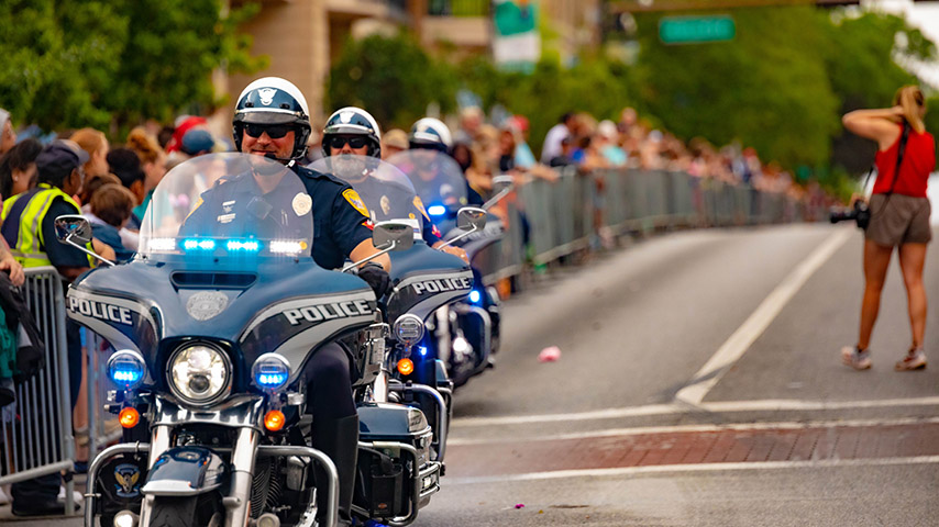 TPD motorcycle officers driving as part of a parade